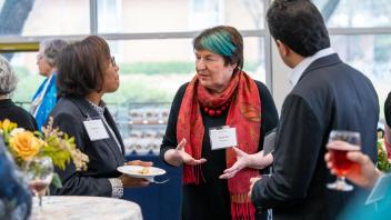 UC Davis Dean Helene Dillard and Vice Provost and Dean Joanna Regulska talking at the International Connections Reception