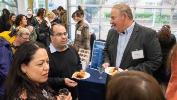 Attendees talking at the UC Davis International Connections Reception
