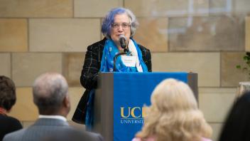 UC Davis Director of Faculty Engagement Elizabeth Langridge Noti speaks at a podium