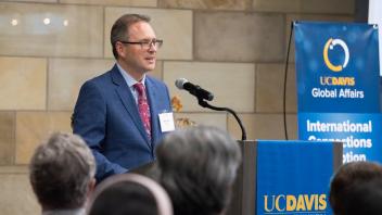UC Davis Associate Vice Provost Michael Lazzara speaks from a podium at the International Connections Reception