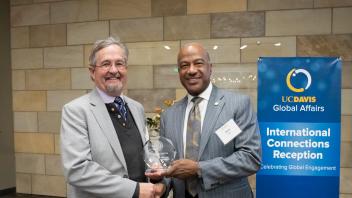 UC Davis faculty Michael Carter receives the Chancellor's Award for International Engagement from Chancellor Gary S. May