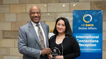 UC Davis staff Jennifer Chow receives the Chancellor's Award for International Engagement from Chancellor Gary S. May